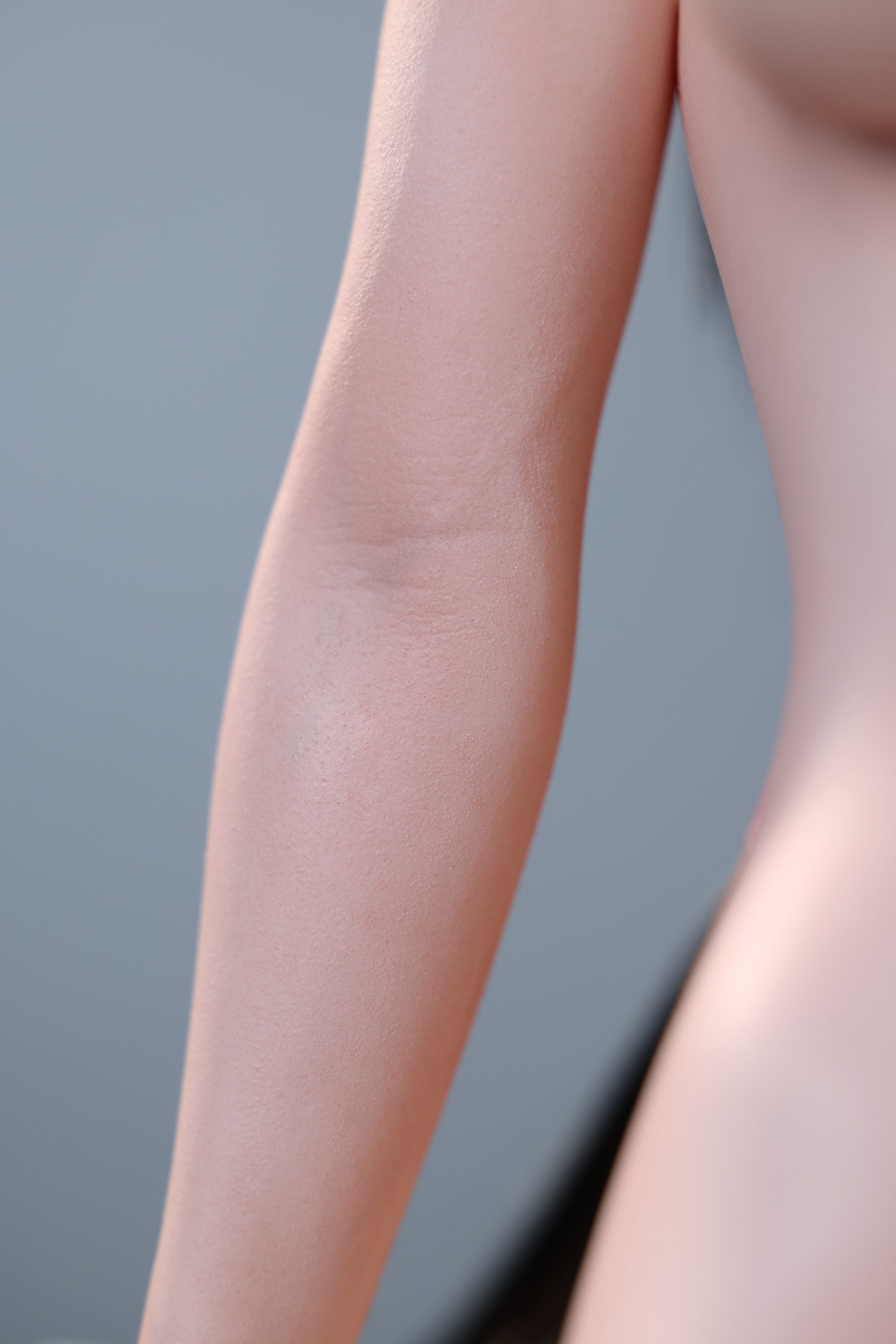 Naked legs on a gray background