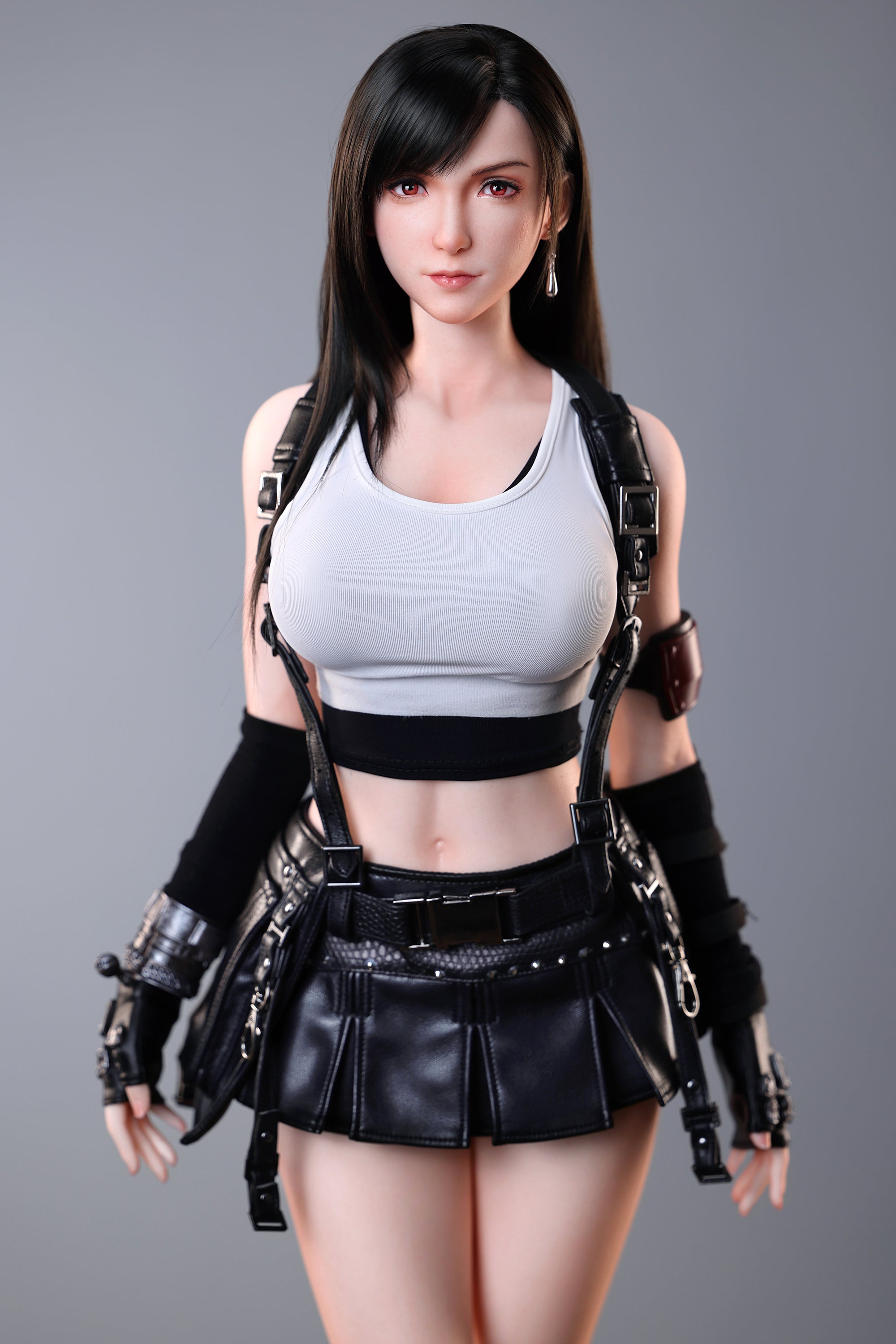 Tifa wearing a gray tank top, black leather skirt, and tactical gear on a gray background