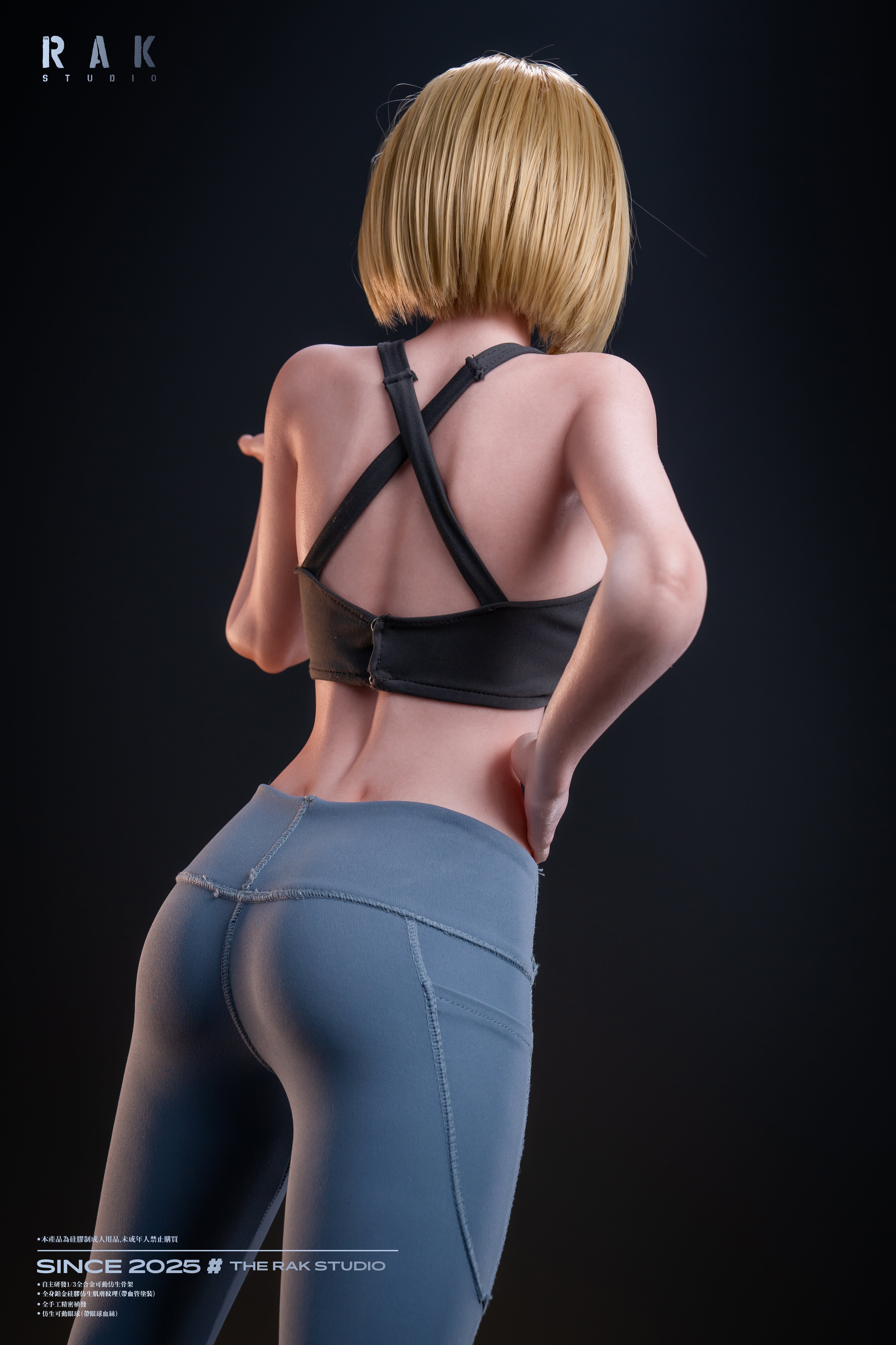 Person wearing a black sports bra and blue leggings on a dark background with &